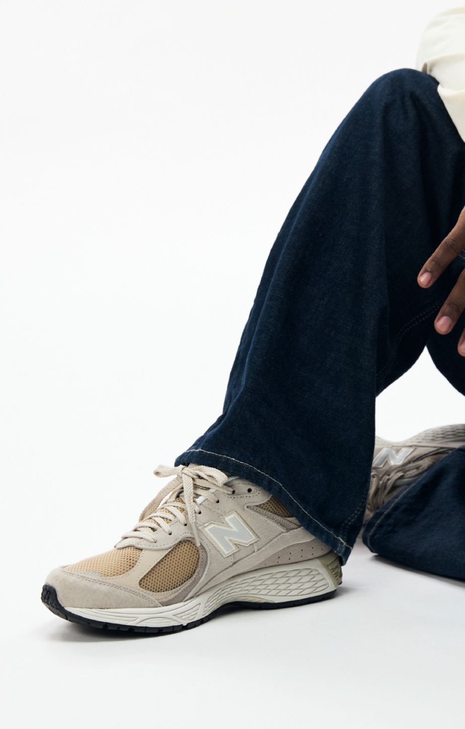 Close up of someone wearing new balance 2002s